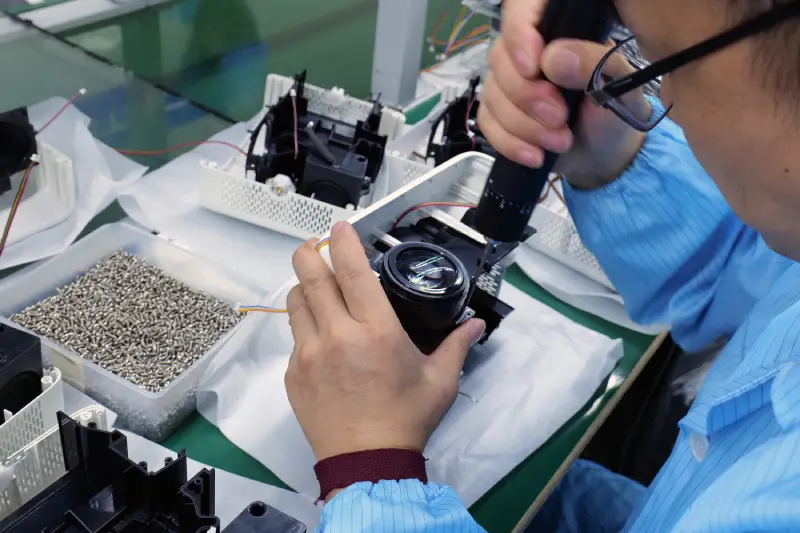 Hotack projector assembly at manufacturing facility